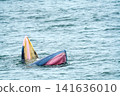 Bryde whale lunge feeding in the ocean, showing baleen plates and pink mouth. Rare aquatic wildlife moment in the Gulf of Thailand. Professional nature photography of a marine mammal surfacing. 141636010