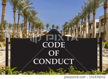 Code of conduct words symbol. Concept words Code of conduct on beautiful black road sign. Beautiful blue sky palm trees background. Business Code of conduct concept. Copy space. 141636032