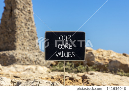 Our core values words symbol. Concept words Our core values on beautiful black blackboard. Beautiful stone and blue sky background. Business our core values motivational support concept. Copy space. Our core values words symbol. Concept words Our core values on beautiful black blackboard. Beautiful stone and blue sky background. Business our core values motivational support concept. Copy space. 141636048