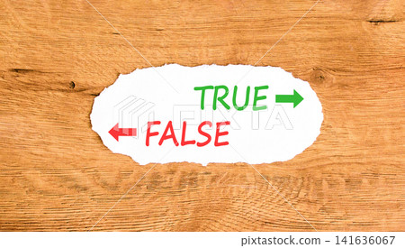 True or false symbol. Concept word True or False on beautiful white paper. Beautiful wooden background. Business and true or false concept. Copy space. True or false symbol. Concept word True or False on beautiful white paper. Beautiful wooden background. Business and true or false concept. Copy space. 141636067