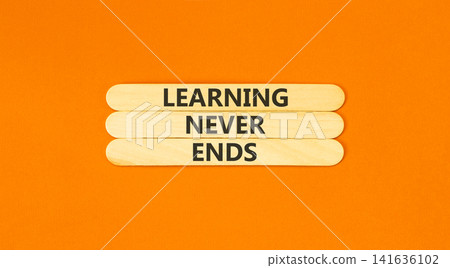 Learning never ends words symbol. Concept words Learning never ends on beautiful wooden sticks. Beautiful orange background. Business support motivational and learning never ends concept. Copy space. 141636102