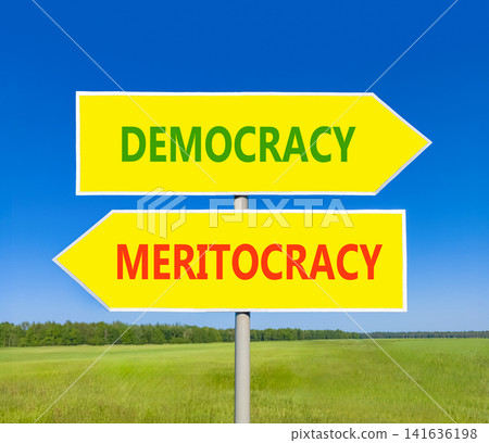 Democracy or meritocracy words symbol. Concept words Democracy Meritocracy on beautiful yellow road sign. Beautiful blue sky background. Business democracy meritocracy concept. Copy space Democracy or meritocracy words symbol. Concept words Democracy Meritocracy on beautiful yellow road sign. Beautiful blue sky background. Business democracy meritocracy concept. Copy space 141636198