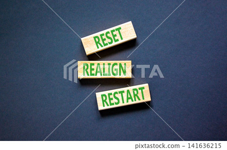 Reset realign restart words symbol. Concept words Reset realign restart on beautiful wooden blocks. Beautiful black background. Business motivational and reset realign restart concept. Copy space. Reset realign restart words symbol. Concept words Reset realign restart on beautiful wooden blocks. Beautiful black background. Business motivational and reset realign restart concept. Copy space. 141636215