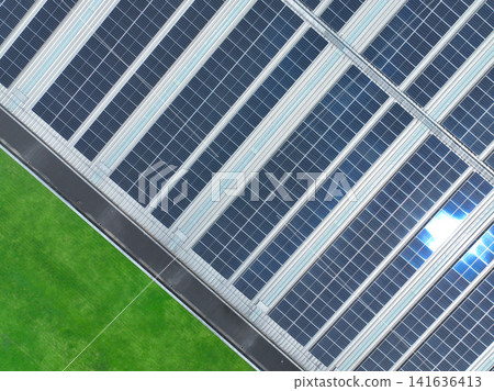 Solar energy for factory and warehouse building. Solar panels on roof of industrial plant. Commercial solar power. Rooftop solar power. Rooftop renewable energy system. Sustainable green energy. Solar energy for factory and warehouse building. Solar panels on roof of industrial plant. Commercial solar power. Rooftop solar power. Rooftop renewable energy system. Sustainable green energy. 141636413