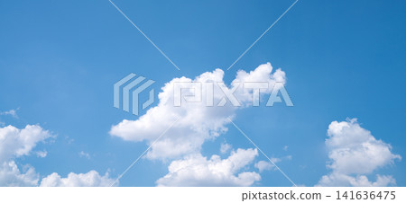 Beautiful blue sky and white cumulus clouds abstract background. Cloudscape background. Blue sky and fluffy white clouds on sunny days. Beautiful blue sky. World Ozone Day. Ozone layer. Summer sky. Beautiful blue sky and white cumulus clouds abstract background. Cloudscape background. Blue sky and fluffy white clouds on sunny days. Beautiful blue sky. World Ozone Day. Ozone layer. Summer sky. 141636475