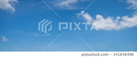 Beautiful blue sky and white cumulus clouds abstract background. Cloudscape background. Blue sky and fluffy white clouds on sunny days. Blue sky and daylight. World Ozone Day. Ozone layer. Summer sky. Beautiful blue sky and white cumulus clouds abstract background. Cloudscape background. Blue sky and fluffy white clouds on sunny days. Blue sky and daylight. World Ozone Day. Ozone layer. Summer sky. 141636496