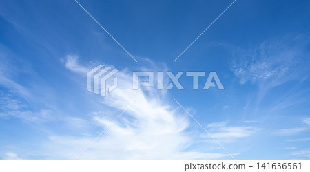 Blue sky and white cirrocumulus clouds texture background. Blue sky on sunny day. Summer sky. Cloud formation. Fluffy clouds. Nice weather in summer season. Weather pattern. Atmospheric phenomenon. Blue sky and white cirrocumulus clouds texture background. Blue sky on sunny day. Summer sky. Cloud formation. Fluffy clouds. Nice weather in summer season. Weather pattern. Atmospheric phenomenon. 141636561