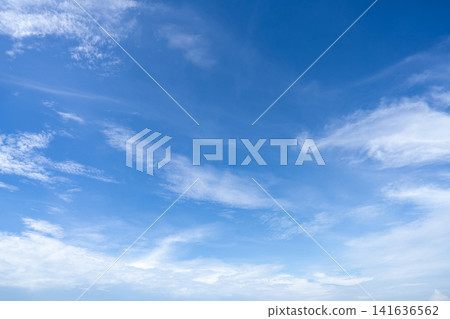 Blue sky and white cirrocumulus clouds texture background. Blue sky on sunny day. Summer sky. Cloud formation. Fluffy clouds. Nice weather in summer season. Weather pattern. Atmospheric phenomenon. Blue sky and white cirrocumulus clouds texture background. Blue sky on sunny day. Summer sky. Cloud formation. Fluffy clouds. Nice weather in summer season. Weather pattern. Atmospheric phenomenon. 141636562
