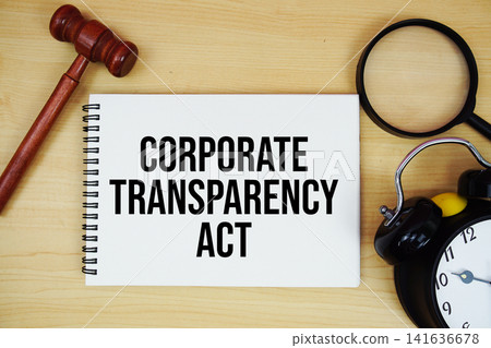 Corporate Transparency Act text written on notepad with pen, alarm clock and judge gavel on wooden background Corporate Transparency Act text written on notepad with pen, alarm clock and judge gavel on wooden background 141636678