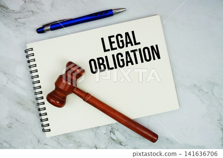 Legal Obligation text written on notepad with pen and judge gavel on marble background Legal Obligation text written on notepad with pen and judge gavel on marble background 141636706