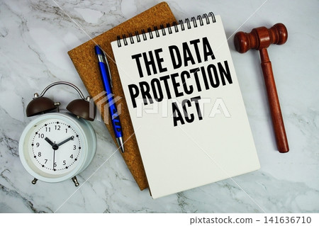 The Data Protection Act text written on notepad with pen, alarm clock and judge gavel on marble background The Data Protection Act text written on notepad with pen, alarm clock and judge gavel on marble background 141636710
