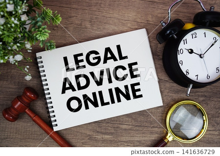 Legal Advice Online message written on notepad with alarm clock, wood gavel and magnifying glass flat lay on wooden background Legal Advice Online message written on notepad with alarm clock, wood gavel and magnifying glass flat lay on wooden background 141636729