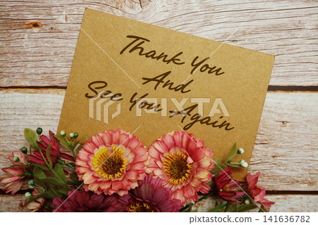 Thank You And See You Again text written on paper card with flowers decorations 141636782