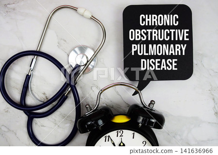 Chronic Obstructive Pulmonary Disease (COPD) text with stethoscope and alarm clock on marble background Chronic Obstructive Pulmonary Disease (COPD) text with stethoscope and alarm clock on marble background 141636966
