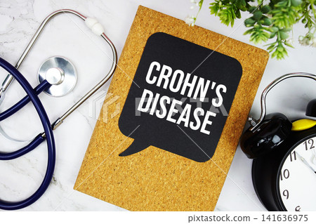 Crohn's Disease text with stethoscope and alarm clock on marble background Crohn's Disease text with stethoscope and alarm clock on marble background 141636975