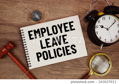 Employee Leave Policies message written on notepad with alarm clock, wood gavel and magnifying glass flat lay on wooden background Employee Leave Policies message written on notepad with alarm clock, wood gavel and magnifying glass flat lay on wooden background 141637011