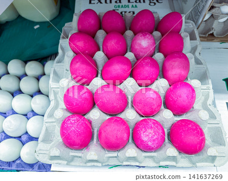 Bright pink dyed eggs in a cardboard carton on display at a market - 07.05.2026, Auburn WA, USA. Bright pink dyed eggs in a cardboard carton on display at a market - 07.05.2026, Auburn WA, USA. 141637269