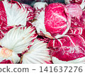 Fresh red radicchio heads with vibrant red and white leaves on display 141637276