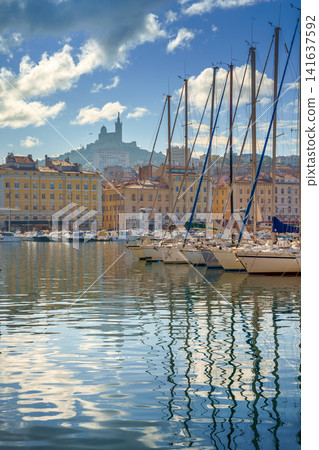 The Old Port Vieux Port of Marseille with Basilique Notre-Dame de la Garde blurred in the fog and the yauchts The Old Port Vieux Port of Marseille with Basilique Notre-Dame de la Garde blurred in the fog and the yauchts 141637592