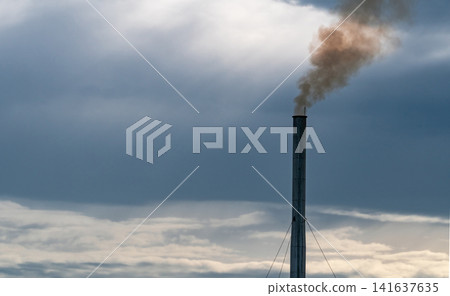 Air pollution from factory. Smoke from chimney of industrial pipe on sunset sky. Global warming problem concept. Bad air quality. Air pollutant emission factors. Air contamination. PM 2.5 dust. Air pollution from factory. Smoke from chimney of industrial pipe on sunset sky. Global warming problem concept. Bad air quality. Air pollutant emission factors. Air contamination. PM 2.5 dust. 141637635