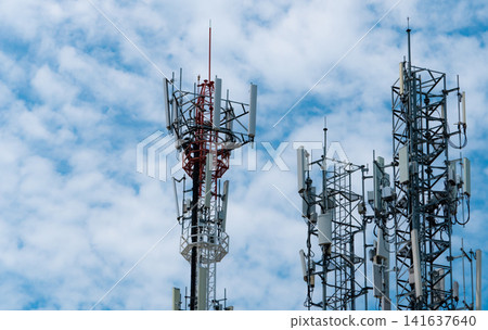 Telecommunication tower with blue sky and white clouds background. Antenna on blue sky. Radio and satellite pole. Communication technology. Telecommunication industry. Mobile or telecom 4g network. Telecommunication tower with blue sky and white clouds background. Antenna on blue sky. Radio and satellite pole. Communication technology. Telecommunication industry. Mobile or telecom 4g network. 141637640