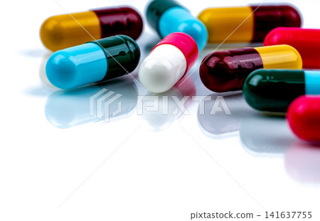Colorful pharmaceutical capsule medication on white background, healthcare and pharmacy concept for prescription medicine, hospital treatment and medical industry. Pharmaceutical industry. Colorful pharmaceutical capsule medication on white background, healthcare and pharmacy concept for prescription medicine, hospital treatment and medical industry. Pharmaceutical industry. 141637755