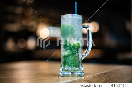 Glass With Fresh Mint Alcohol Mojito On A Table Glass With Fresh Mint Alcohol Mojito On A Table 141637914