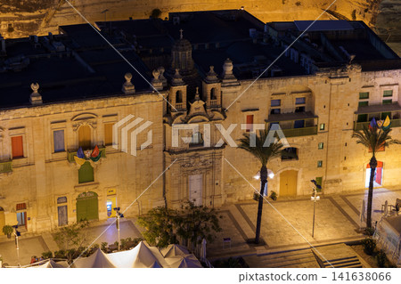 VALLETTA, MALTA - NOVEMBER 12, 2018 - Panoramic night view of a coast line and the downtown of the city with different landmarks VALLETTA, MALTA - NOVEMBER 12, 2018 - Panoramic night view of a coast line and the downtown of the city with different landmarks 141638066