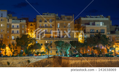Panoramic night view of a coast line and the downtown of Valletta, Malta with different landmarks of the city Panoramic night view of a coast line and the downtown of Valletta, Malta with different landmarks of the city 141638069