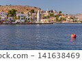 Symi Harbor Waterfront with Clock Tower and Colorful Houses on Symi Island Greece 141638469