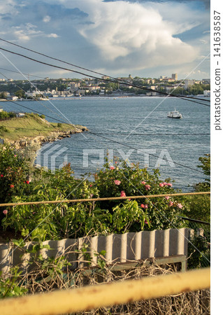 Sevastopol Bay in spring - Severnaya Storona waterfront with flowering coastline, Crimea, Ukraine Sevastopol Bay in spring - Severnaya Storona waterfront with flowering coastline, Crimea, Ukraine 141638587