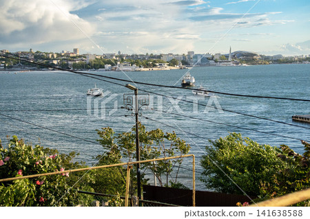 Sevastopol Bay in spring - Severnaya Storona waterfront with flowering coastline, Crimea, Ukraine Sevastopol Bay in spring - Severnaya Storona waterfront with flowering coastline, Crimea, Ukraine 141638588