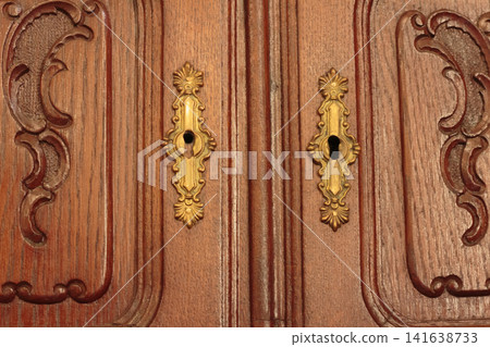 Vintage Wooden Cabinet Doors with Ornamental Brass Keyholes Vintage Wooden Cabinet Doors with Ornamental Brass Keyholes 141638733