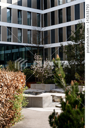 Modern Munich Urban Courtyard Garden - Green Space With Blooming Flowers - Contemporary Bavarian Building Courtyard With Landscaping Design Modern Munich Urban Courtyard Garden - Green Space With Blooming Flowers - Contemporary Bavarian Building Courtyard With Landscaping Design 141638793