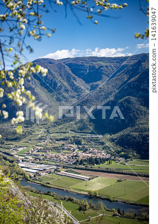 Adige River Valley And Dolci Village Viewed From Placca Del Forte San Marco: Panoramic Spring Landscape Near Lake Garda Adige River Valley And Dolci Village Viewed From Placca Del Forte San Marco: Panoramic Spring Landscape Near Lake Garda 141639047