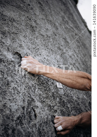 Climber Using Side Pocket Grip With Taped Fingers On Rock Surface: Close Up Of Precision Hand Placement Outdoors Climber Using Side Pocket Grip With Taped Fingers On Rock Surface: Close Up Of Precision Hand Placement Outdoors 141639090