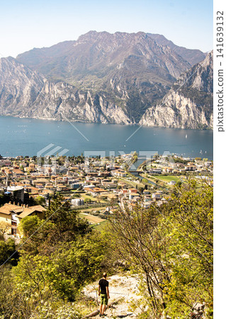 Panoramic View Over Riva Del Garda From Belvedere Climbing Garden: Scenic Landscape In Province Of Trento At Lake Garda Italy Panoramic View Over Riva Del Garda From Belvedere Climbing Garden: Scenic Landscape In Province Of Trento At Lake Garda Italy 141639132