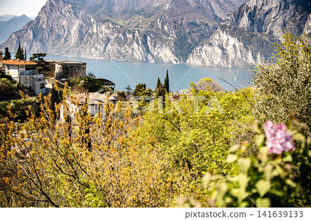 Panoramic View Over Riva Del Garda From Belvedere Climbing Garden: Scenic Landscape In Province Of Trento At Lake Garda Italy Panoramic View Over Riva Del Garda From Belvedere Climbing Garden: Scenic Landscape In Province Of Trento At Lake Garda Italy 141639133