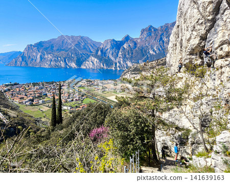 Panoramic View Over Riva Del Garda From Belvedere Climbing Garden: Scenic Landscape In Province Of Trento At Lake Garda Italy Panoramic View Over Riva Del Garda From Belvedere Climbing Garden: Scenic Landscape In Province Of Trento At Lake Garda Italy 141639163