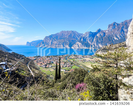 Panoramic View Over Riva Del Garda From Belvedere Climbing Garden: Scenic Landscape In Province Of Trento At Lake Garda Italy Panoramic View Over Riva Del Garda From Belvedere Climbing Garden: Scenic Landscape In Province Of Trento At Lake Garda Italy 141639206