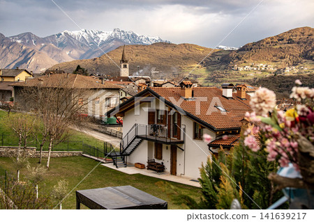 Frenten Mountain Village With Snow Capped Peaks: Scenic Rural Landscape Near Lake Garda In Trentino Italy Frenten Mountain Village With Snow Capped Peaks: Scenic Rural Landscape Near Lake Garda In Trentino Italy 141639217