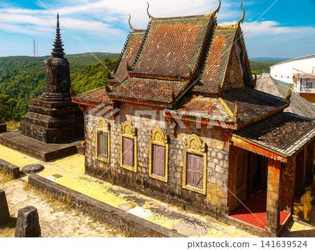 Ancient Buddhist temple and stone stupa at Wat Sampov Pram on Bokor Mountain overlooking lush jungle, Kampot, Cambodia Ancient Buddhist temple and stone stupa at Wat Sampov Pram on Bokor Mountain overlooking lush jungle, Kampot, Cambodia 141639524
