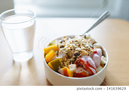 bowl diet breakfast and glass of water in morning bowl diet breakfast and glass of water in morning 141639629