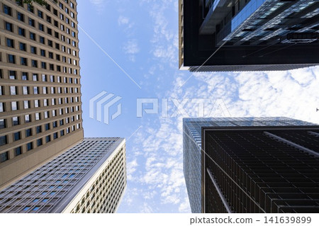 Tokyo's central business district (CBD) is a place where buildings with warm and cool color schemes intersect. Tokyo's central business district (CBD) is a place where buildings with warm and cool color schemes intersect. 141639899