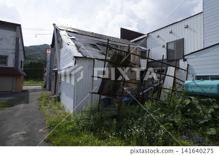 The current state of vacant houses, overgrown with weeds and in imminent danger of collapse. The current state of vacant houses, overgrown with weeds and in imminent danger of collapse. 141640275