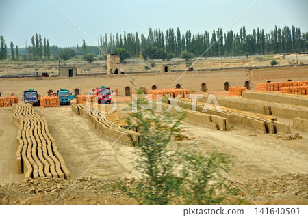 Brick manufacturing plant and drying area in Xinjiang Uyghur Autonomous Region, China Brick manufacturing plant and drying area in Xinjiang Uyghur Autonomous Region, China 141640501