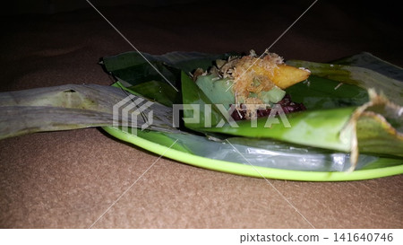 Traditional Indonesian food consists of serabi, lupis, and injin. Traditional Indonesian food consists of serabi, lupis, and injin. 141640746
