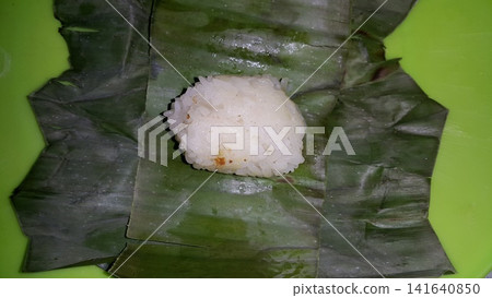 Indonesian Tradisional food called lemper contain rice cake with chicken inside. Indonesian Tradisional food called lemper contain rice cake with chicken inside. 141640850