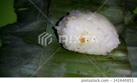Indonesian Tradisional food called lemper contain rice cake with chicken inside. Indonesian Tradisional food called lemper contain rice cake with chicken inside. 141640851