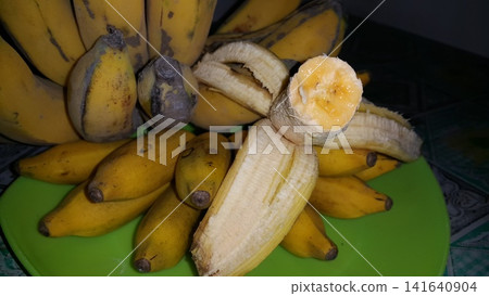 Shot of the contents of a partially eaten banana. Bananas are still fresh and very delicious. Shot of the contents of a partially eaten banana. Bananas are still fresh and very delicious. 141640904
